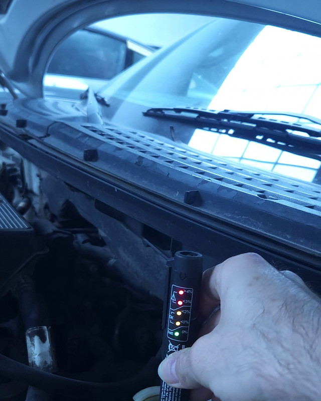Brake fluid condition being tested in the Bella Motor workshop