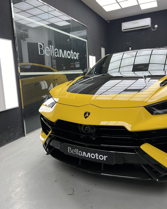 Yellow Lamborghini Urus with a deep gloss finish at Bella Motor, Dubai