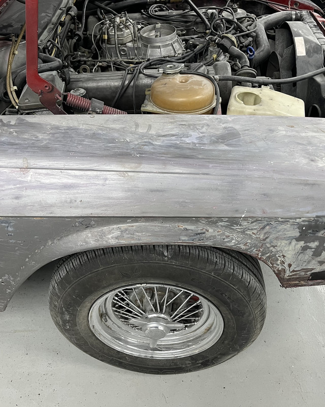 Classic car body stripped to bare metal