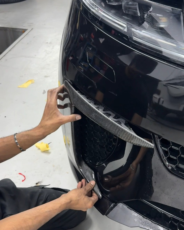 New front bumper parts being fitted