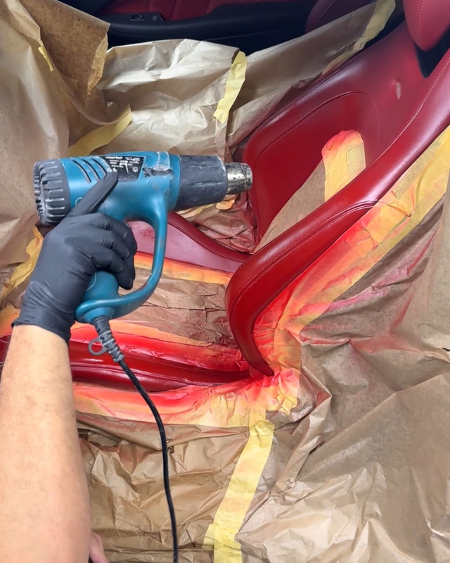 Red leather seat being dried after re-dyeing