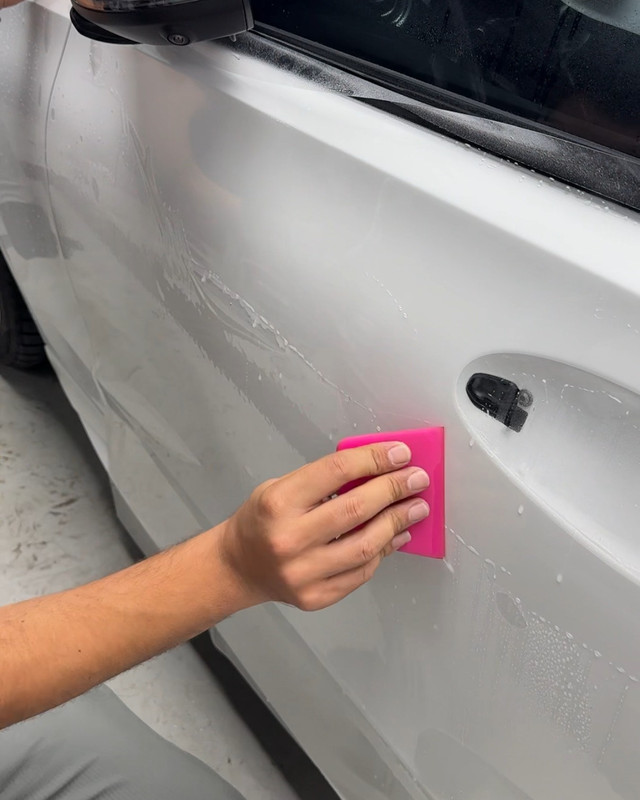 PPF squeegeed onto a white door