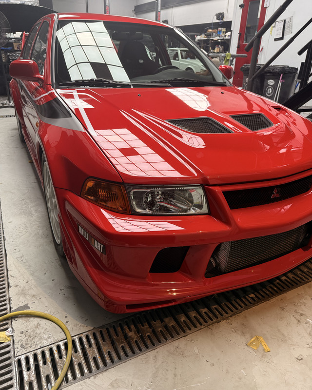 Red Mitsubishi Evo in the workshop