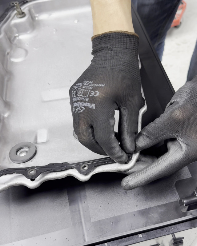 Transmission pan and filter during an oil service